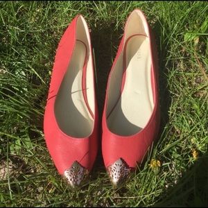 Coral gold tip flats.